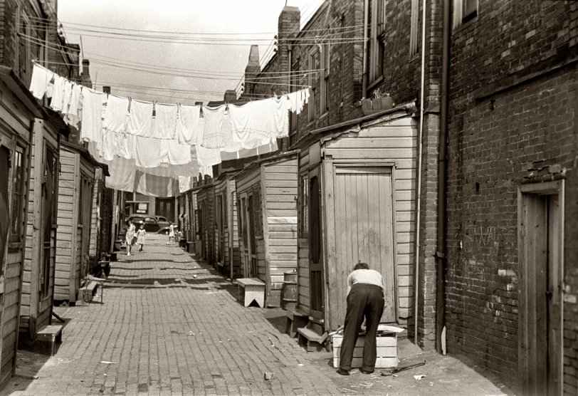 July 1938. Back alley showing housing conditions in Ambridge, Pennsylvania. View full size. 35mm nitrate negative by Arthur Rothstein for the FSA.