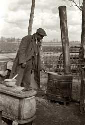 January 1939. An evicted sharecropper among his possessions in New Madrid County, Missouri. View full size. 35mm nitrate negative by Arthur Rothstein.