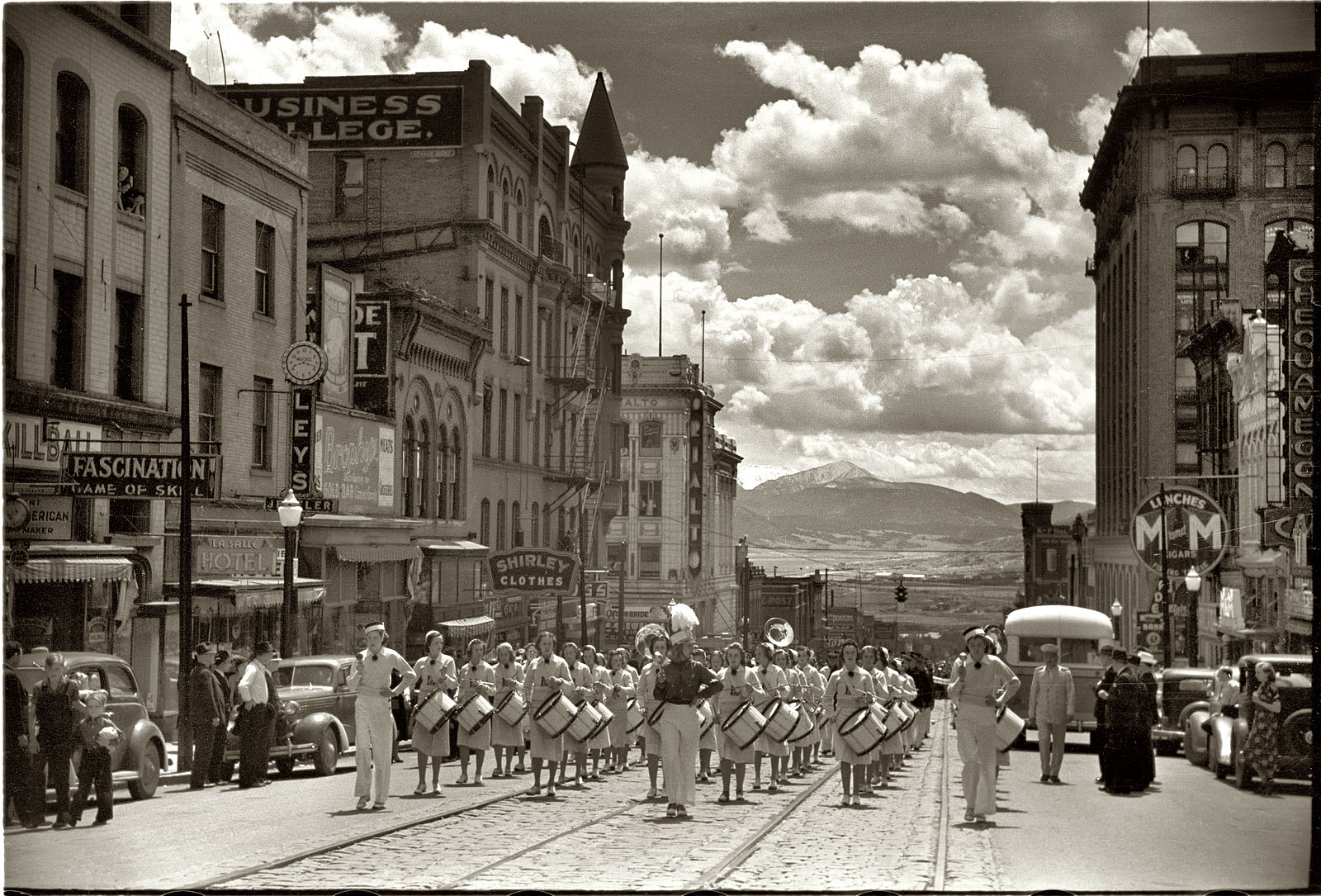 Summer 1939. Butte, Montana. "High school band parading up Montana street." View full size. 35mm nitrate negative by Arthur Rothstein for the FSA.