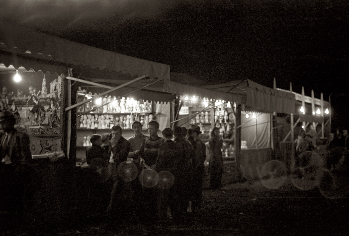 Summer 1939. "Amusements on the carnival midway. Bozeman, Montana." 35mm nitrate negative by Arthur Rothstein for the FSA. View full size.