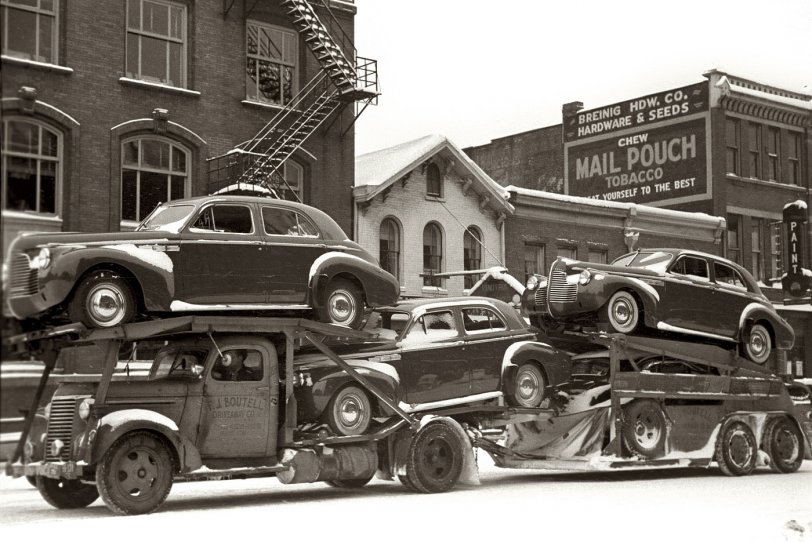 Photo of: Sleigh Ride: 1940 -- February 1940. Automobile transport carrying new Buicks in Chillicothe, Ohio. 35mm nitrate negative by Arthur Rothstein for the FSA. View full size.