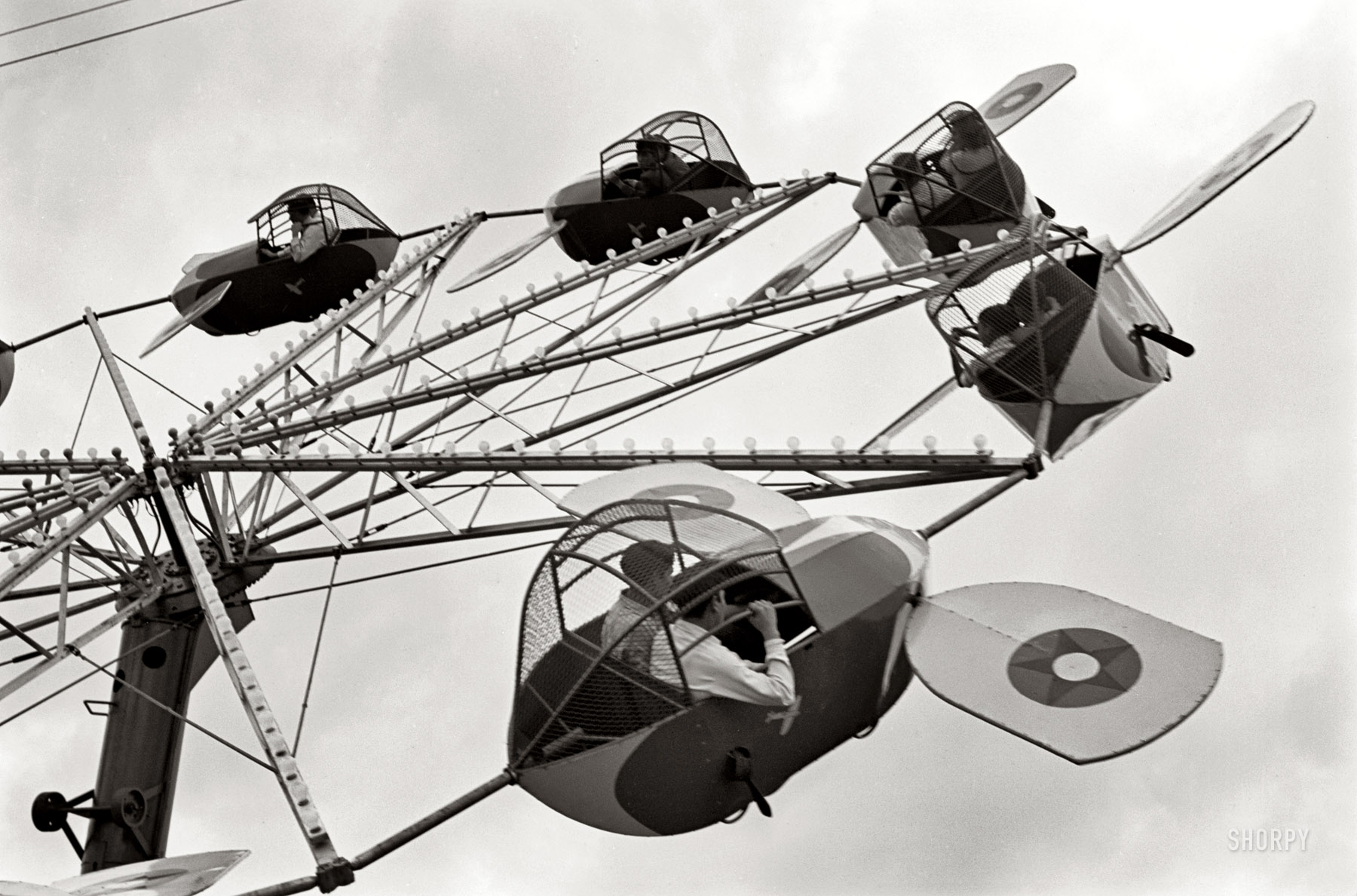 February 1942. "Brownsville, Texas. Carnival ride." 35mm nitrate negative by Arthur Rothstein for the Farm Security Administration. View full size. 