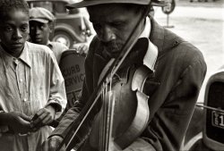 October 1935. "Blind street musician. West Memphis, Arkansas." View full size. 35mm nitrate negative by Ben Shahn for the Resettlement Administration.