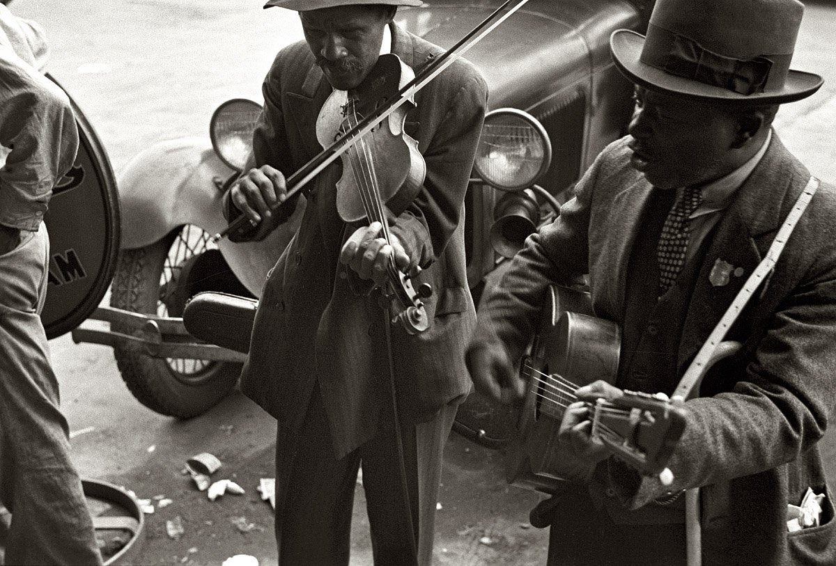 October 1935. "Street musicians. Blind fiddler. West Memphis, Arkansas." 35mm negative by Ben Shahn for the Farm Security Administration. View full size.