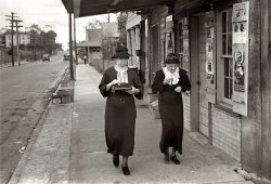 October 1935. Natchez, Mississippi. "Two women walking along the street."  35mm negative by Ben Shahn for the Resettlement Administration. View full size.