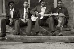 October 1935. Scanned from an uncaptioned 35mm nitrate negative of an unidentified musician and his friends, probably photographed by Ben Shahn in Scotts Run, West Virginia. Anyone recognize them? View full size.