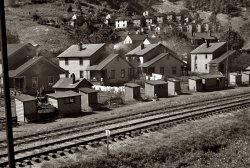 October 1935. Coal miners' houses in Omar, West Virginia. View full size. 35mm nitrate negative by Ben Shahn for the Farm Security Administration.