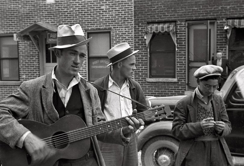 October 1935. Street musician in Maynardville, Tennessee. View full size. Photograph by Ben Shahn. Another shot here. Scan from 35mm nitrate negative.
