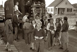 October 1935. Our third shot of Red House, West Virginia, youngsters on the way to school by truck. 35mm negative by Ben Shahn for the FSA. View full size.