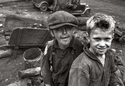 Boys salvaging coal from the slag heaps at Nanty Glo, Pennsylvania. 1937. They get 10 cents for each hundred-pound sack. View full size. Photo by Ben Shahn.