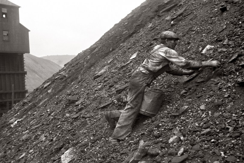 Photo of: Nanty Glo Slagger: 1937 -- 1937. Salvaging coal from the slag heap at Nanty Glo, Pennsylvania. Coal pickers get 10 cents for each hundred-pound sack or two dollars a ton. One man can make from 10 to 20 sacks a day. View full size. Photograph by Ben Shahn.