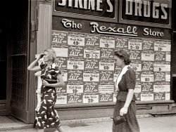 Summer 1938. Drugstore window in Newark, Ohio. View full size. Photograph (35mm nitrate negative) by Ben Shahn, Farm Security Administration.