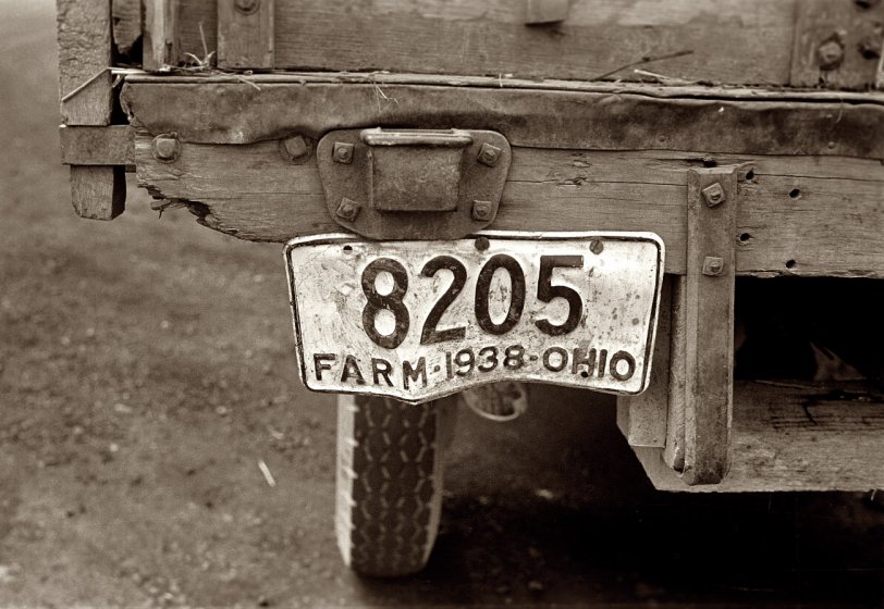 Summer 1938. "On Route 40 in central Ohio, moving combine and tractor." 35mm negative by Ben Shahn for the Farm Security Administration. View full size.
