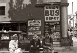 Summer 1938. Passing the time outside the bus station in Marion, Ohio. 35mm nitrate negative by Ben Shahn, Farm Security Administration. View full size.