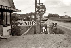 Summer 1938. "Tourist signs in Central Ohio." From a series of photos taken along Route 40. View full size. 35mm nitrate negative by Ben Shahn for the FSA.
