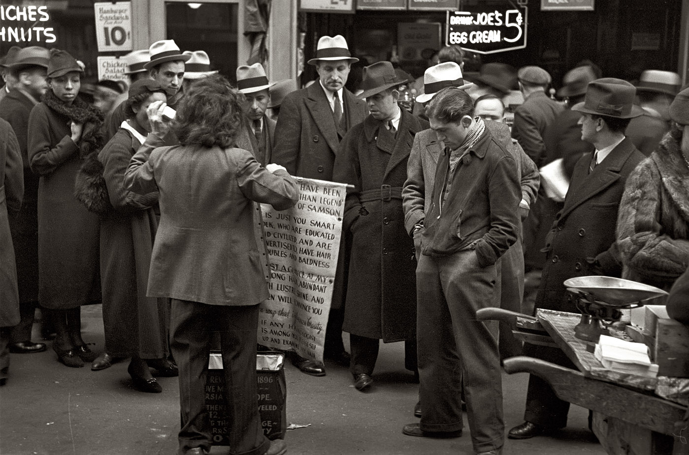 New York, November 1936. "Hair tonic salesman advertising his wares, Seventh Avenue at 38th Street." View full size. 35mm nitrate negative by Russell Lee.