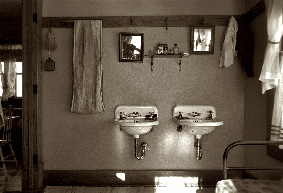 December 1936. "Washroom of Rustan brothers' farmhouse near Dickens, Iowa." View full size. 35mm nitrate negative: Russell Lee, Resettlement Administration