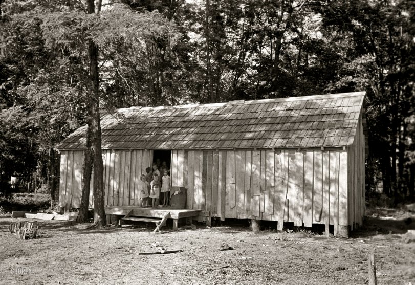 May 1938. New Madrid County, Missouri. "House without windows. Home of sharecropper cut-over farmers of Mississippi bottoms." 35mm nitrate negative by Russell Lee for the Farm Security Administration. View full size.