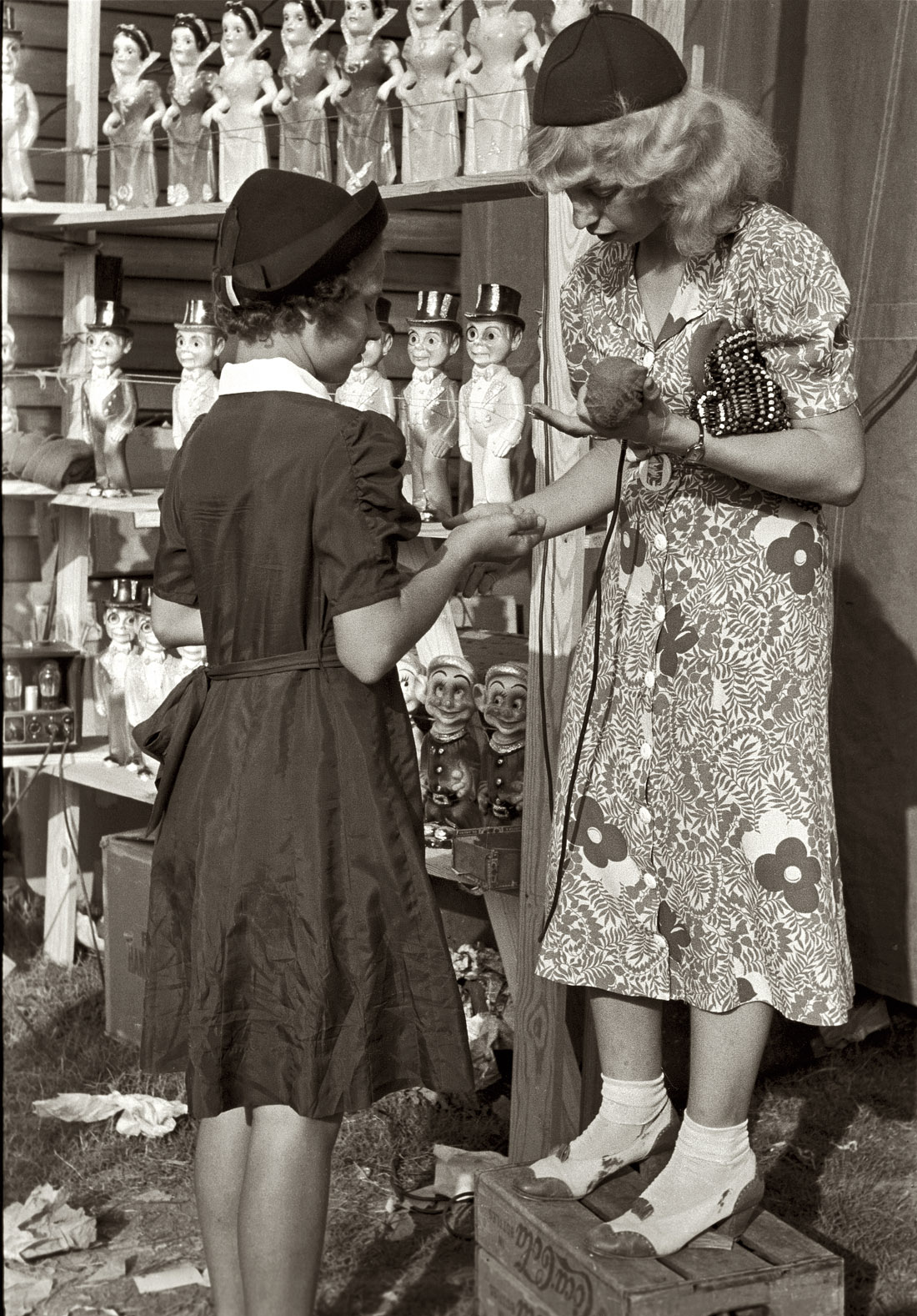 November 1938. Donaldsonville, Louisiana. "Young girl buying doll from concession manager at the state fair." View full size. 35mm nitrate negative by Russell Lee for the Farm Security Administration. Library of Congress.