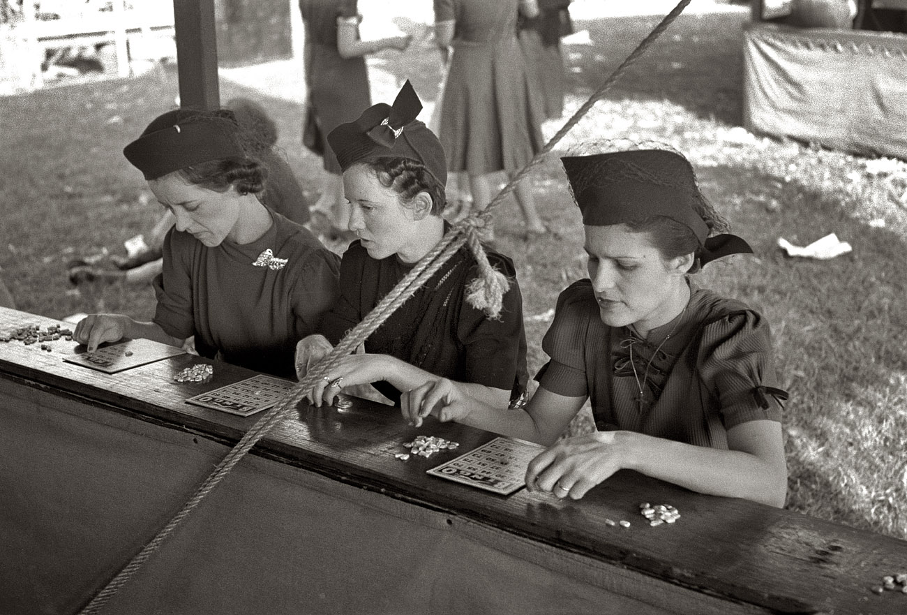 November 1938. "Women playing bingo, a very popular game at the state fair. Donaldsonville, Louisiana." View full size. 35mm negative by Russell Lee.