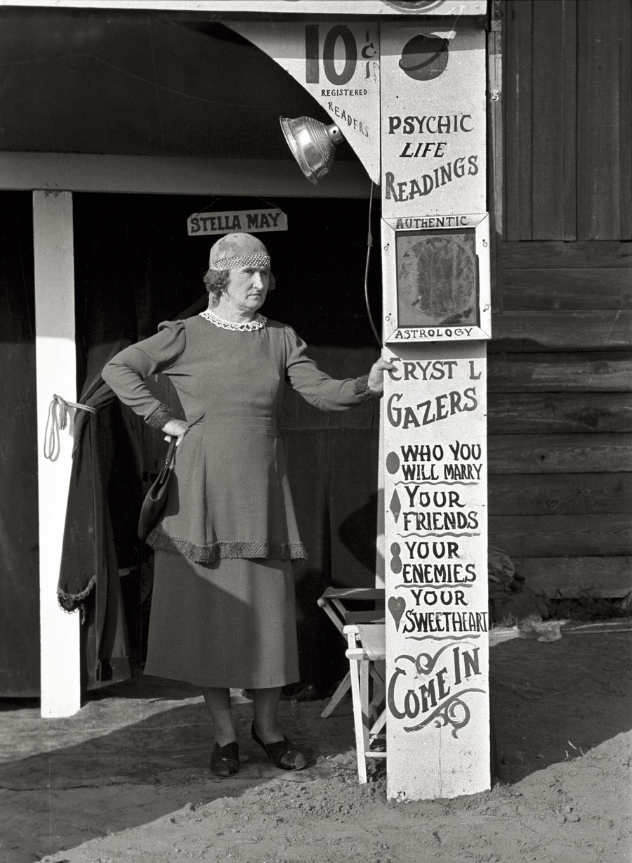 November 1938. "Fortune teller, state fair, Donaldsonville, Louisiana." 35mm negative by Russell Lee for the Farm Security Administration. View full size.