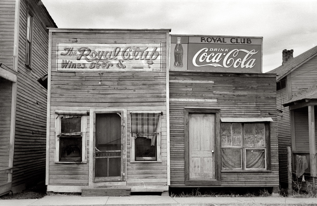 January 1939. "Beer hall. Mound Bayou, Mississippi." View full size. 35mm nitrate negative by Russell Lee for the Farm Security Administration.