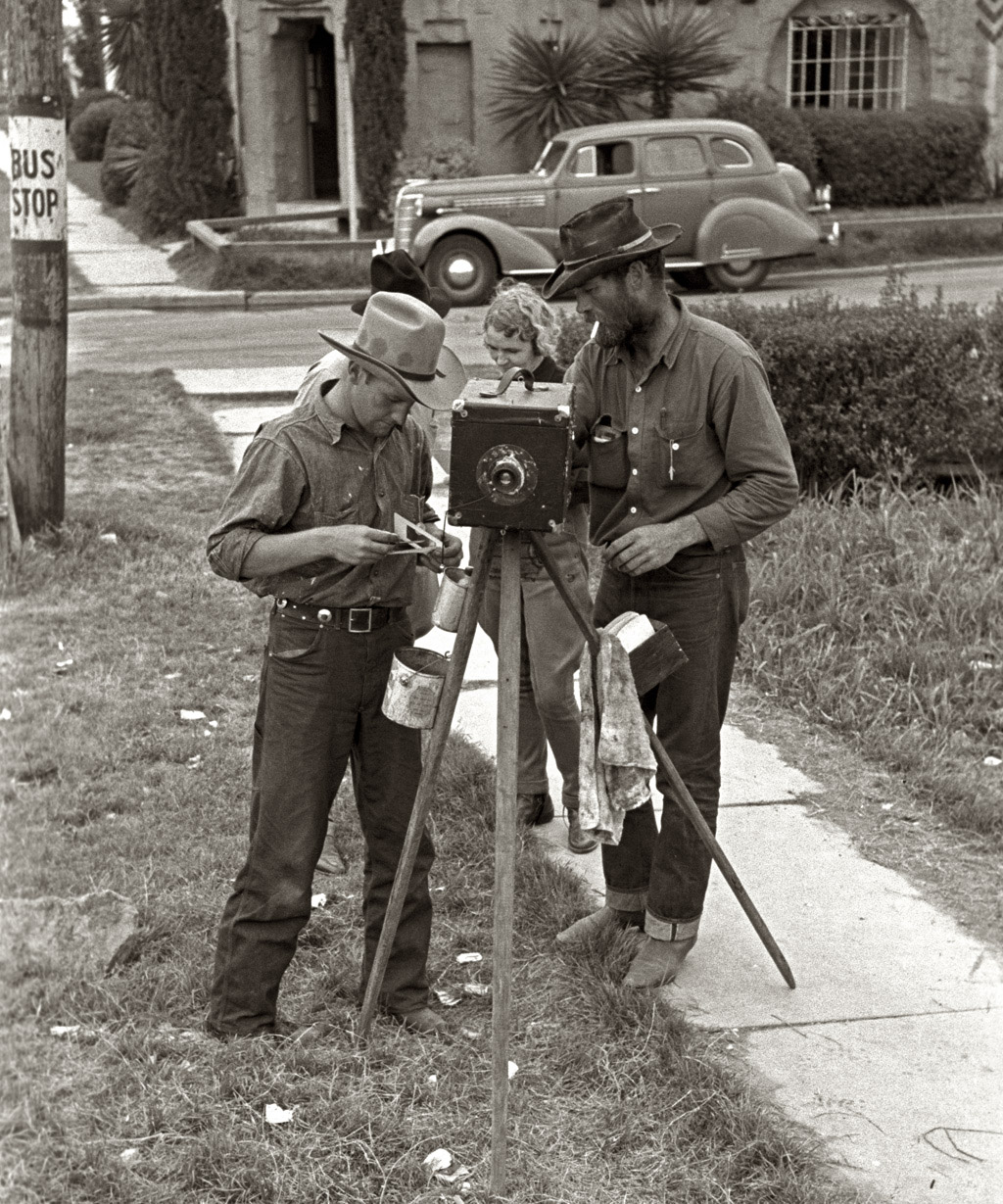 A tintype cameraman on a San Antonio, Texas, street. Photo by Russell Lee, March, 1939. View full size.