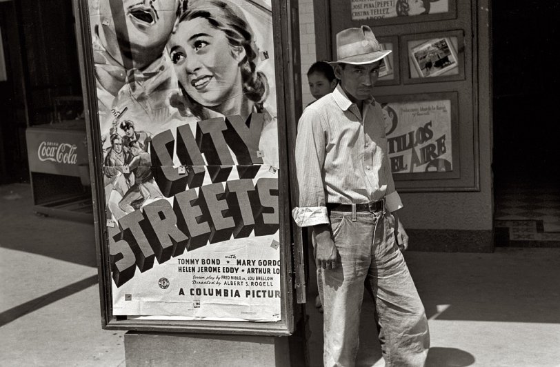 March 1939. "Mexican man in front of movie theater. San Antonio, Texas." 35mm negative by Russell Lee for the Farm Security Administration. View full size.