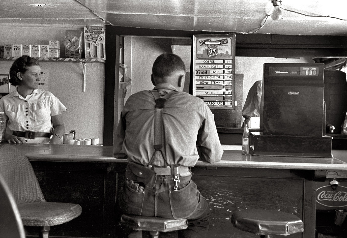 May 1939. "Man in hamburger stand. Alpine, Texas." View full size. 35mm nitrate negative by Russell Lee for the Farm Security Administration.