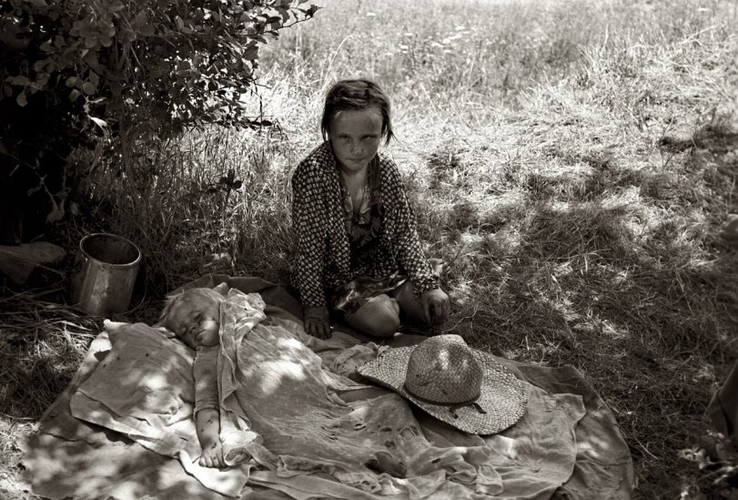 June 1939. "Girl of migrant family camped near Spiro. Sequoyah County, Oklahoma." View full size. 35mm nitrate negative by Russell Lee for the FSA.