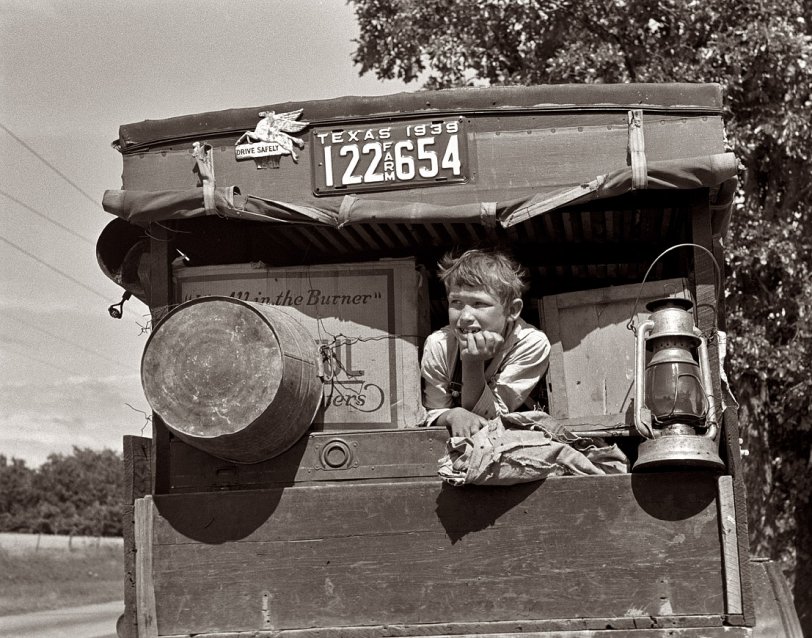 June 1939. Migrant child in family car east of Fort Gibson. Muskogee County, Oklahoma. View full size. 35mm nitrate negative by Russell Lee.
