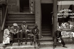 April 1941. "People sitting on front porch in Negro section of Chicago." 35mm negative by Russell Lee for the Farm Security Administration. View full size.