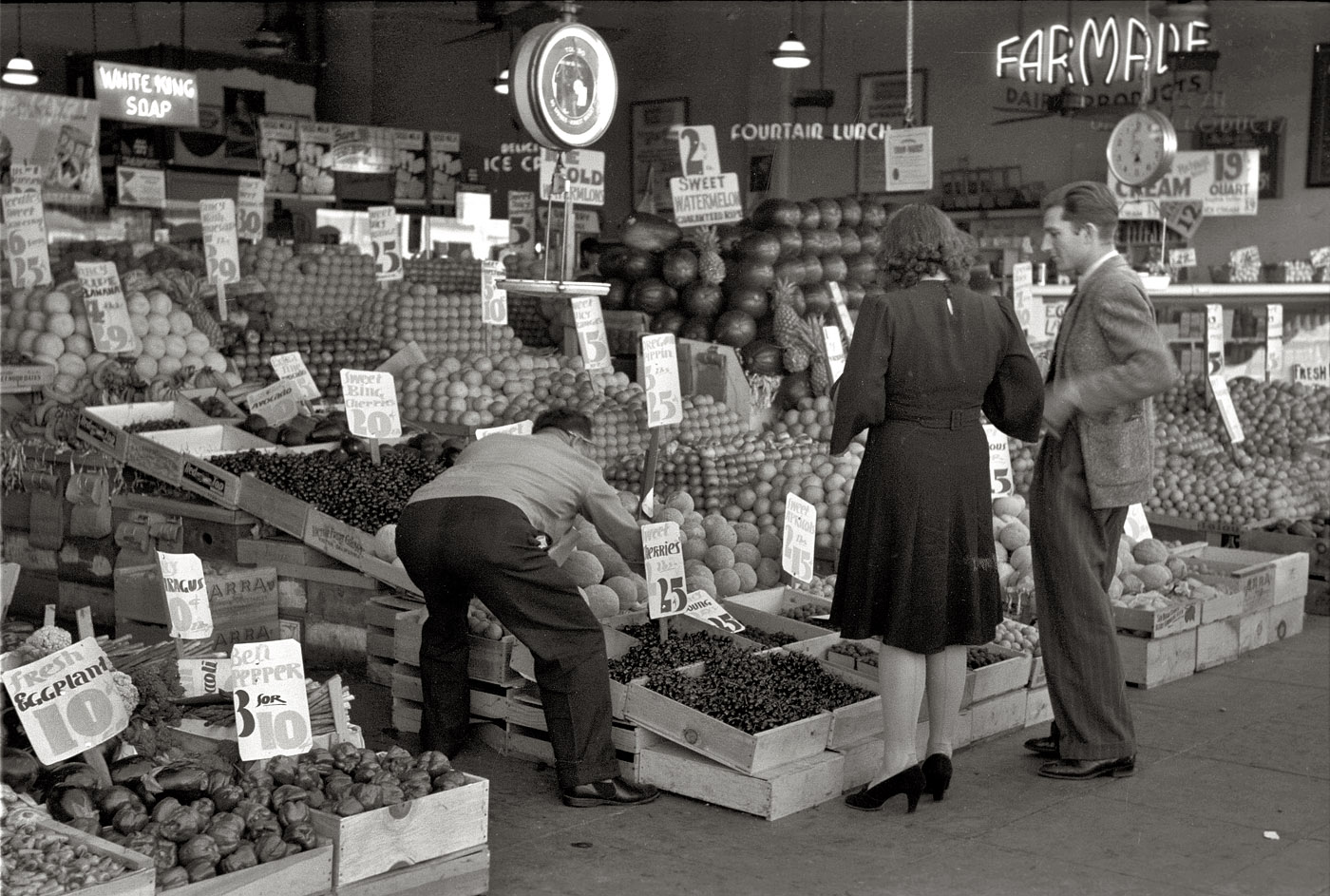 June 1941. Shopping for fruit and vegetables in San Diego. View full size. 35mm nitrate negative by Russell Lee for the Farm Security Administration.