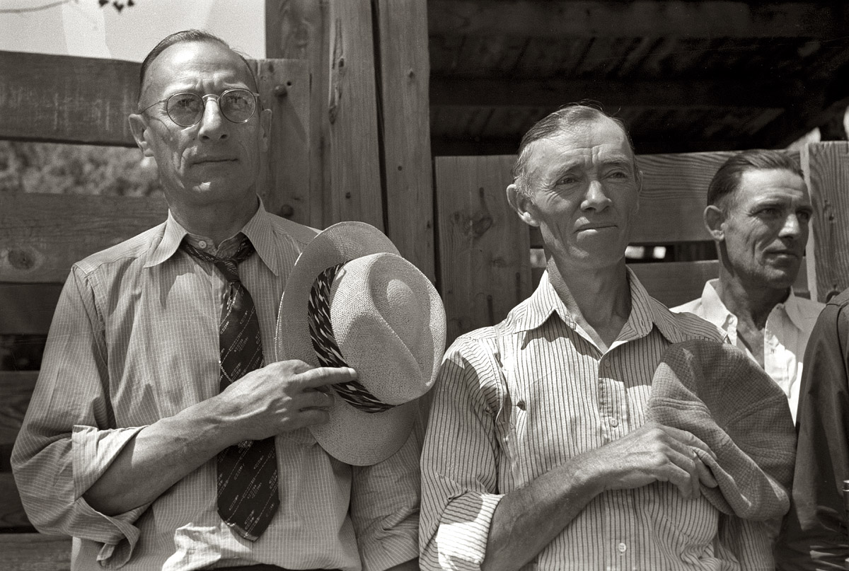 July 1941. "Citizens of Vale, Oregon take off their hats during the Pledge of Allegiance (radio program) on the Fourth of July." View full size. 35mm nitrate negative by Russell Lee for the Farm Security Administration.