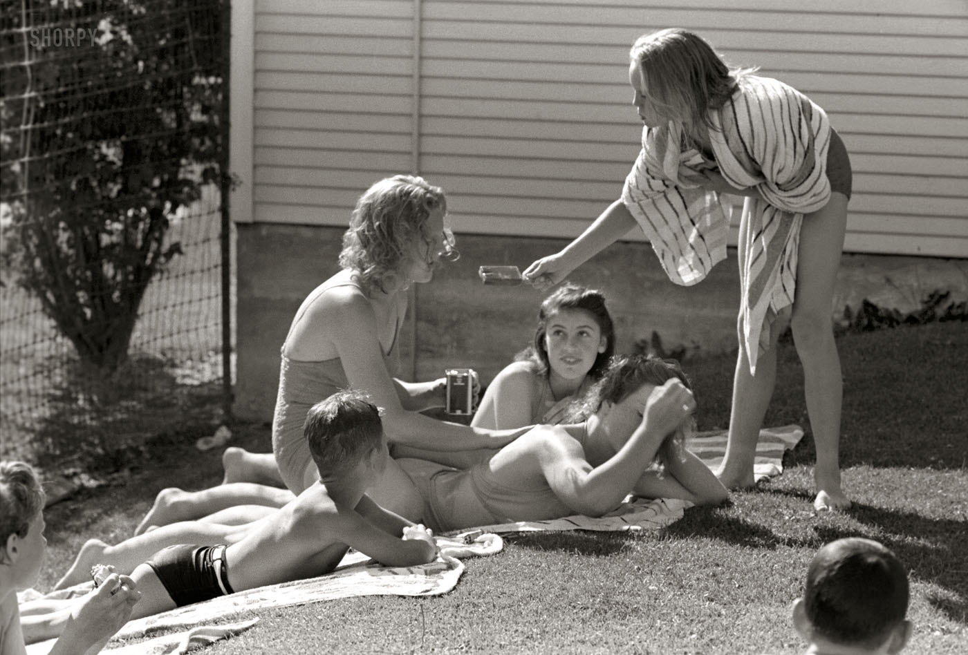 July 1941. Sun bathers at the park swimming pool in Caldwell, Idaho. 35mm nitrate negative by Russell Lee, Farm Security Administration. View full size.