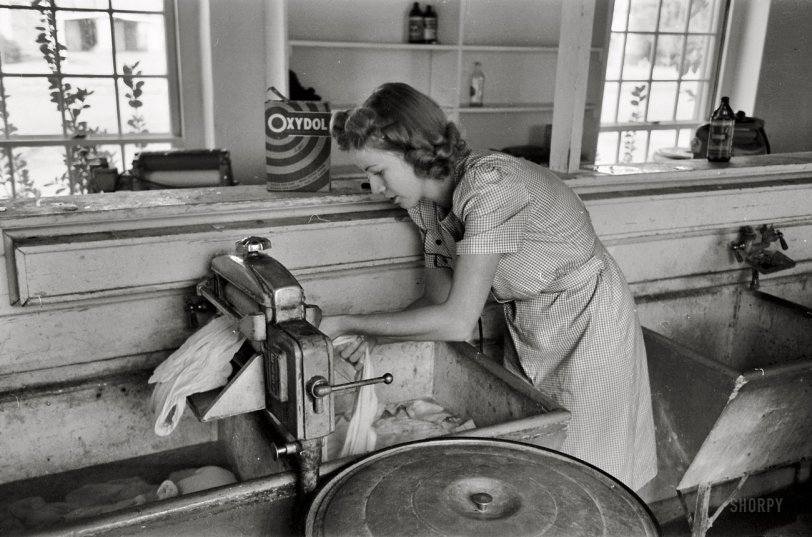 March 1942. Phoenix, Arizona. "Washday at the FSA Camelback Farms." 35mm negative by Russell Lee for the Farm Security Administration. View full size.
