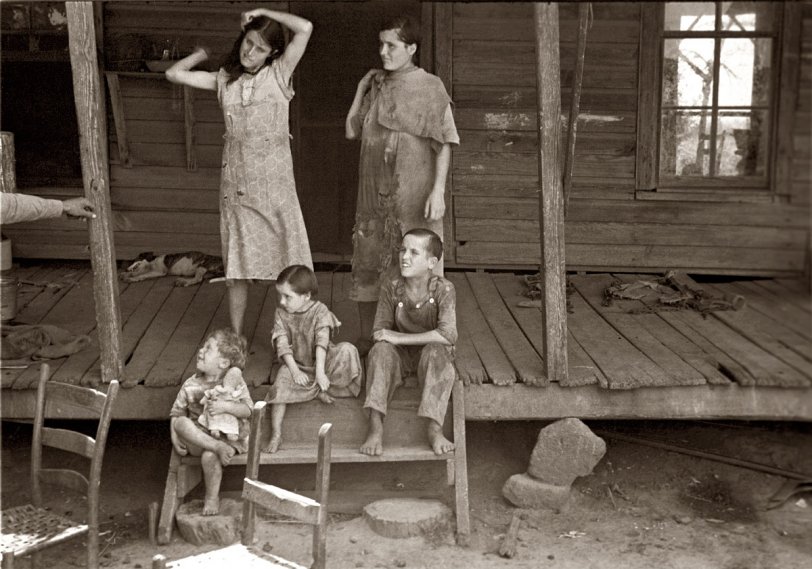 Summer 1936. Children of sharecropper Frank Tengle at their Hale County, Alabama, cabin. View full size. 35mm nitrate negative by Walker Evans.
