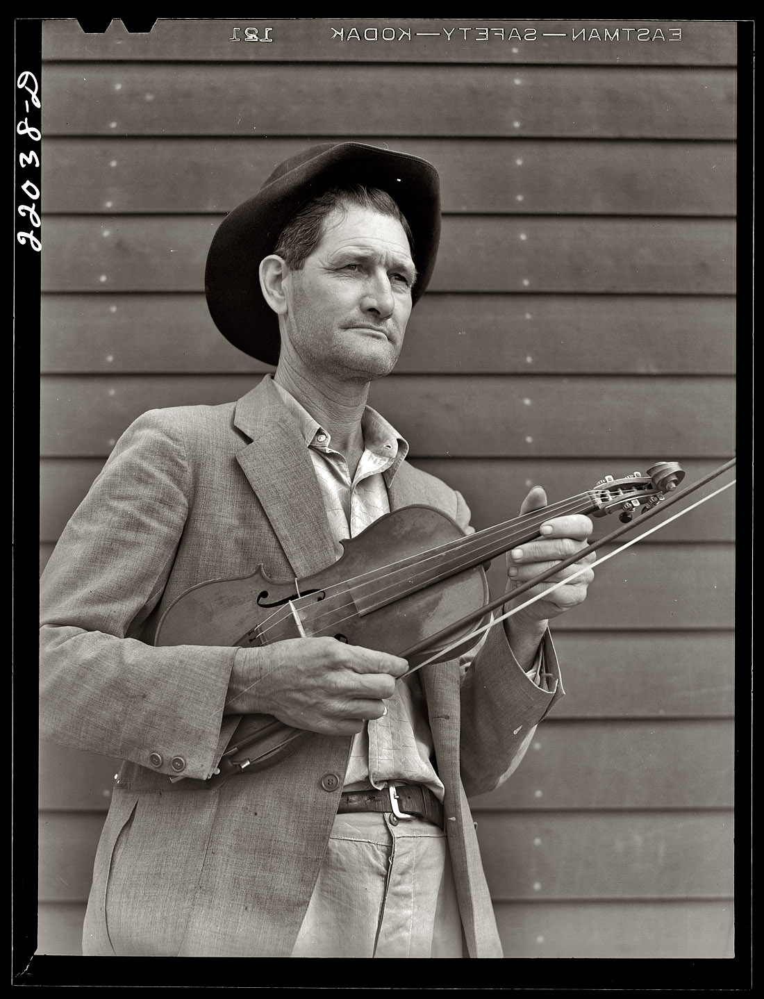 February 1942. The fiddler Nathan Drake at the Farm Security Administration's Mercer Evans relocation camp in Weslaco, Texas. View full size. Medium format safety negative by Arthur Rothstein for the FSA.