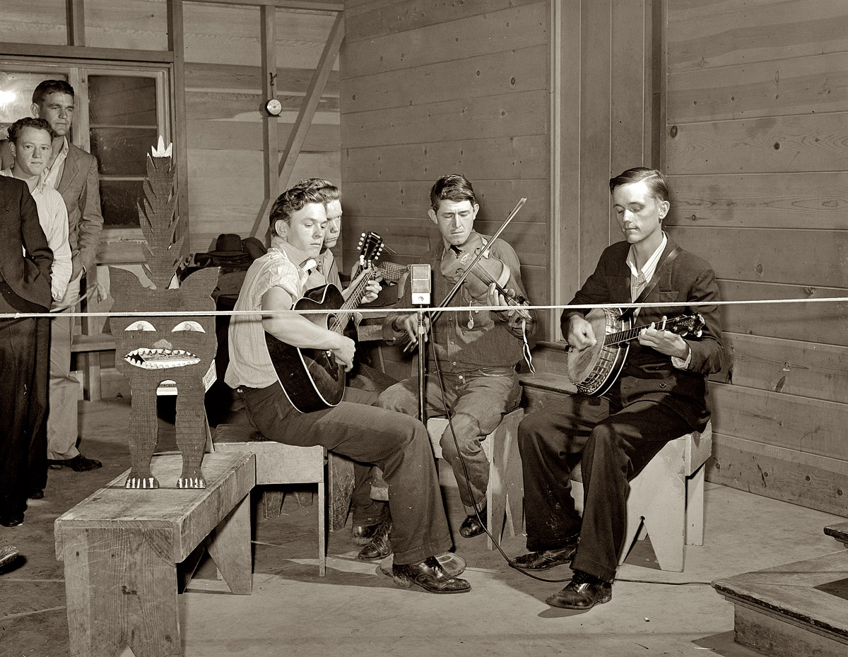 March 1940. Visalia, California. Band playing a Saturday night dance at the Farm Security Administration's Tulare migrant camp. View full size. Medium format safety negative by Arthur Rothstein for the Farm Security Administration.