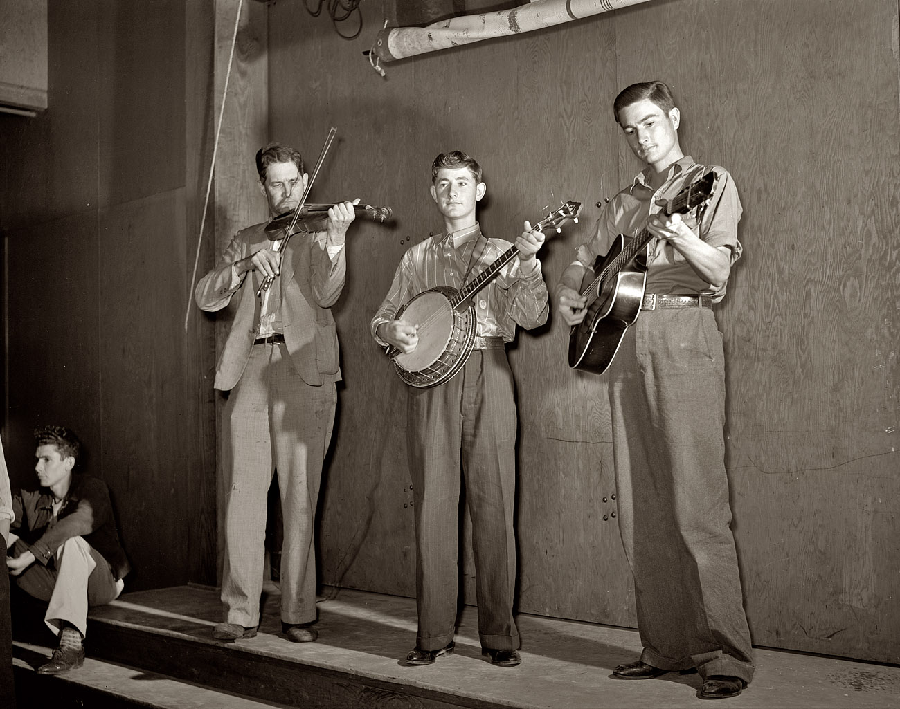 From February 1942, another of Arthur Rothstein's photos of the Drake family entertaining at a Saturday night dance for the Farm Security Administration's resettlement camp at Weslaco, Texas, home to many farm families displaced by the droughts and bankruptcies of the Dust Bowl years. The fiddle player is Nathan Drake; on banjo and guitar are his sons Jasper ("Sleepy") and Weldon. Thanks to Jasper's daughters Connie and Janette for providing the names. View full size. (I'm having a Shorpy family moment here, having heard from the photographer's daughter, Annie Rothstein-Segan, and now Jasper's daughters. Life is a circle.)