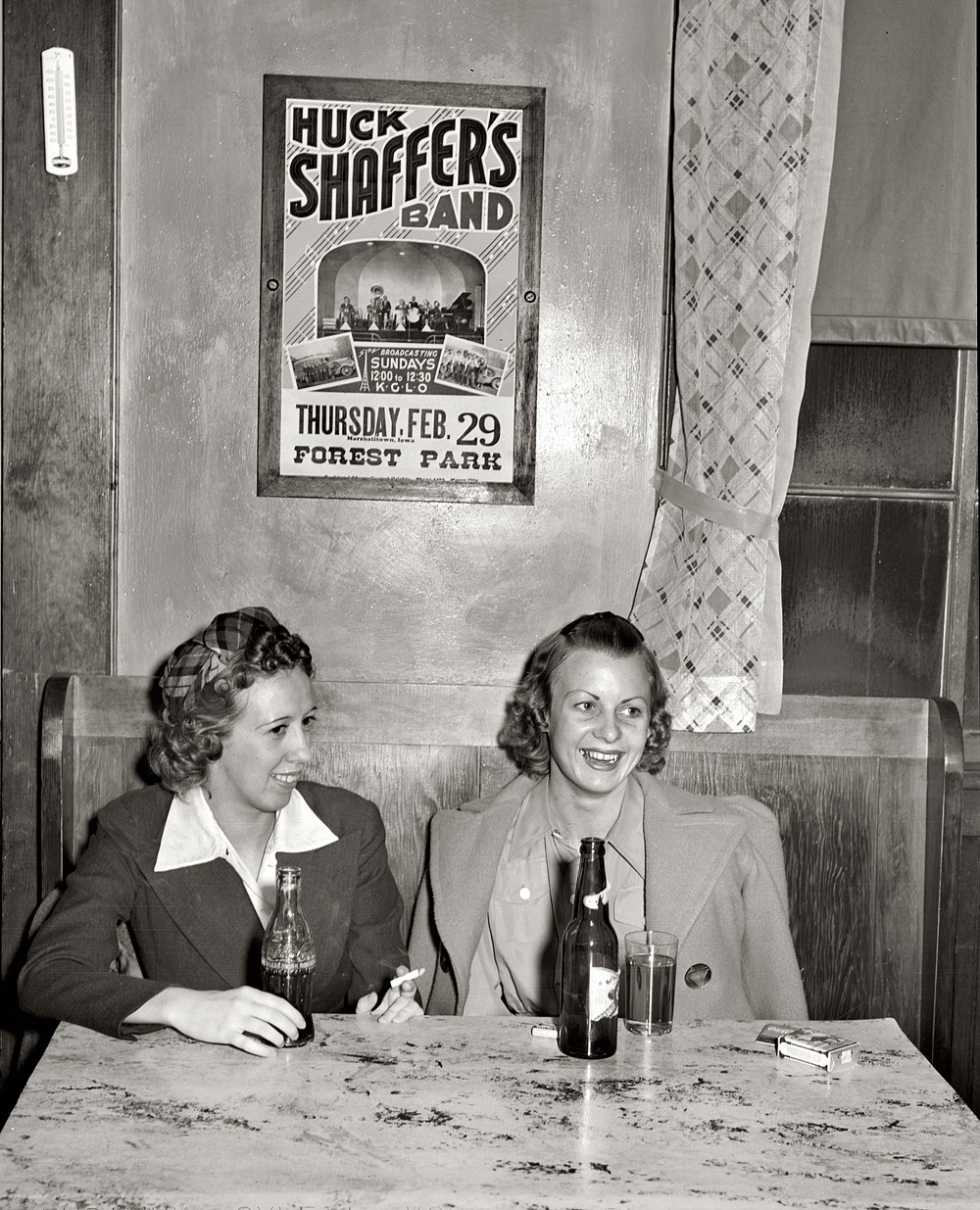February 1940. "Girls in beer parlor adjoining dance hall. Marshalltown, Iowa."  View full size. Medium format safety negative by Arthur Rothstein for the FSA.