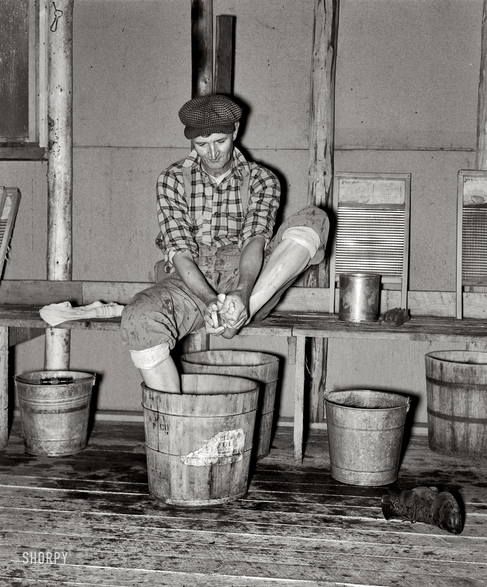 September 1937. "Camp near Effie, Minnesota. Lumberjack washing his feet." Medium format acetate negative by Russell Lee. View full size.