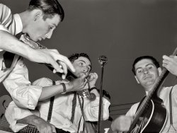 October 1938. "Musicians in cajun band contest at the National Rice Festival. Crowley, Louisiana." View full size. Medium format negative by Russell Lee.