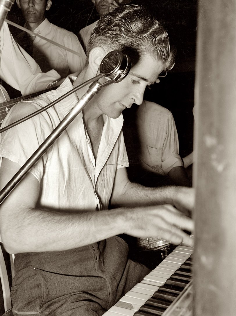 October 1938. "Pianist in cajun band contest. National Rice Festival, Crowley, Louisiana." View full size. Medium format negative by Russell Lee for the FSA.