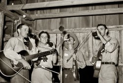 October 1938. "Cajun orchestra for fais-do-do near Crowley, Louisiana. Having intermission with drinks." View full size. Medium format nitrate negative by Russell Lee for the Farm Security Administration.