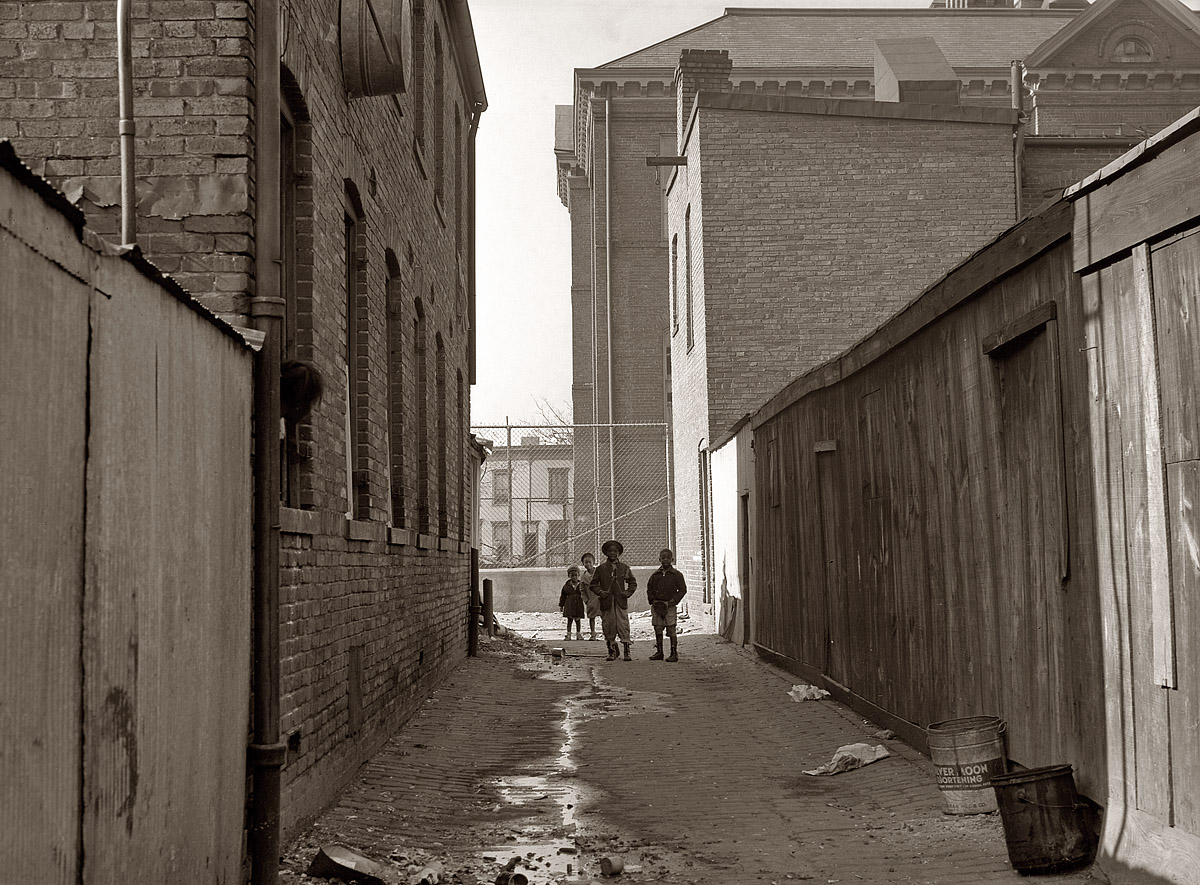 November 1935. Alley near L Street NW with Blake School in background. Washington, D.C. View full size. Photograph by Carl Mydans.