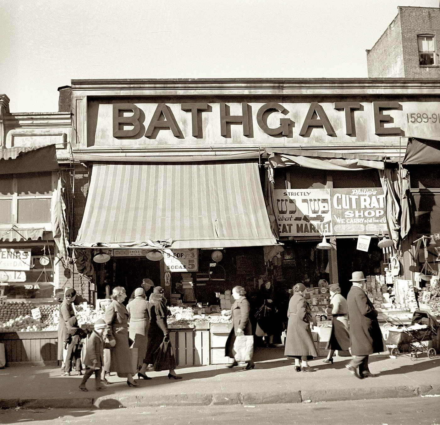 December 1936. "Scene along Bathgate Avenue in the Bronx, a section from which many of the New Jersey homesteaders have come." View full size. Medium format nitrate negative by Arthur Rothstein for the Farm Security Administration.