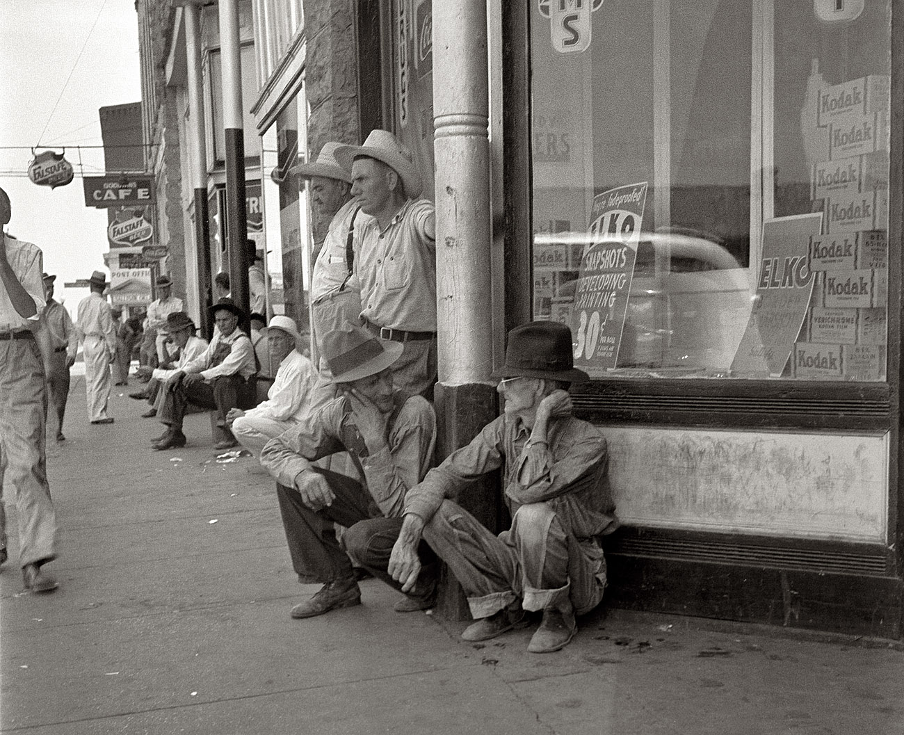 August 1936. Sallisaw, Oklahoma. Sequoyah County drought farmers. "Nothing to do," said one of them. "These fellers are goin' to stay right here till they dry up and die." View full size. Medium-format nitrate negative by Dorothea Lange.