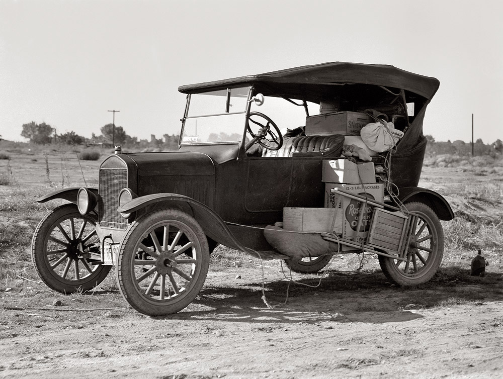 "To serve the crops of California, thousands of families live on wheels. Near Bakersfield, California." View full size. Photograph by Dorothea Lange.