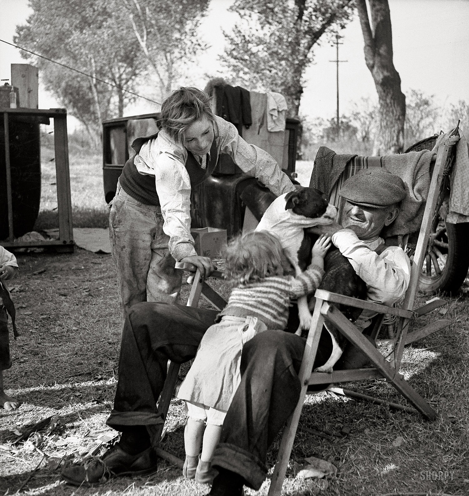 November 1936. "American River camp, Sacramento, California. Destitute family. Five children, aged two to seventeen years." Medium-format nitrate negative by Dorothea Lange for the Resettlement Administration. View full size.